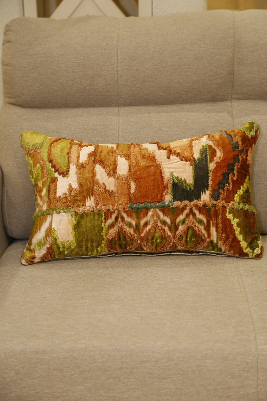 Rust and forest green ikat printed velvet lumbar cushion cover with applique, front view