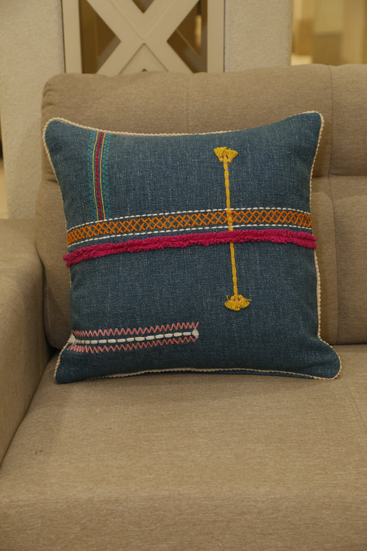 Teal cushion cover with magenta band and traditional hand embroidery, front view