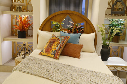 Ivory heritage bedding set styled with the jharokha and rust cushion covers
