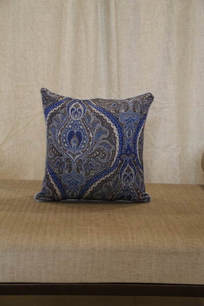 Silver blue paisley silk cushion cover, angled view showing hand embroidery detail
