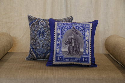 Silver blue paisley cushion cover styled alongside the Royal Blue Jaipur elephant stamp cushion