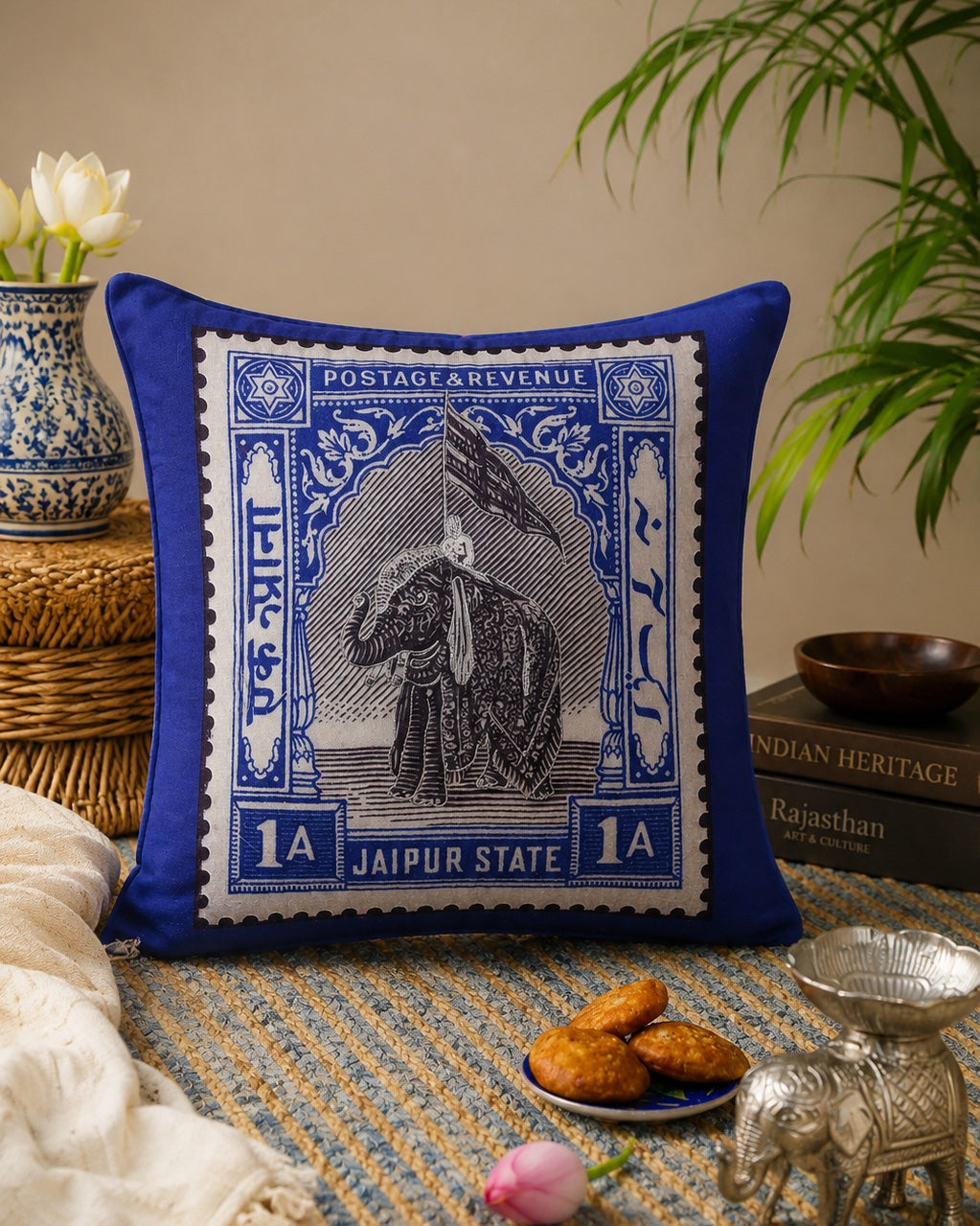 Jaipur elephant stamp cushion paired with a silver blue paisley cushion