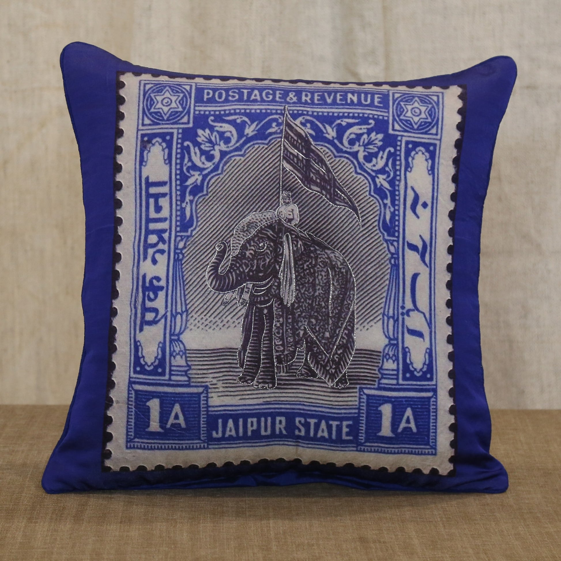 Royal blue silk cushion cover printed with a Jaipur State elephant postage stamp, 18x18 inches