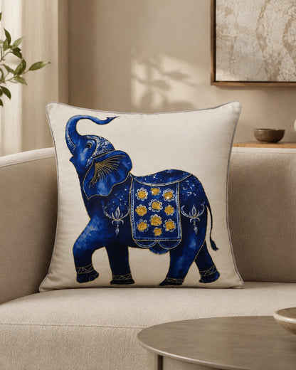 Into the Blue Elephant cushion on a cream sofa in soft daylight