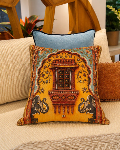 Royal Jharokha cushion layered on a sofa with blue and rust cushions