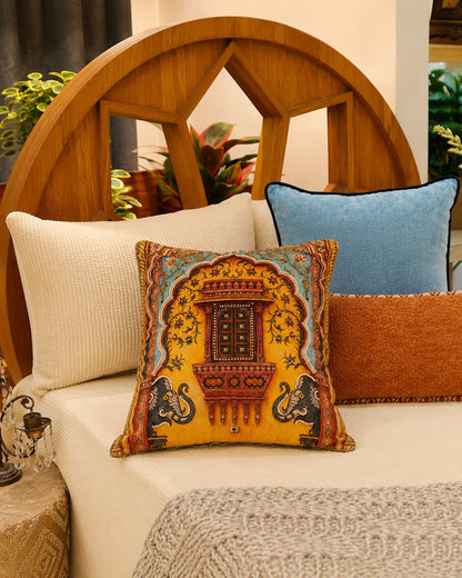 Royal Jharokha cushion on a bed against a carved teak headboard