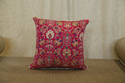 Close detail of the hand embroidery on the ruby red floral silk cushion cover