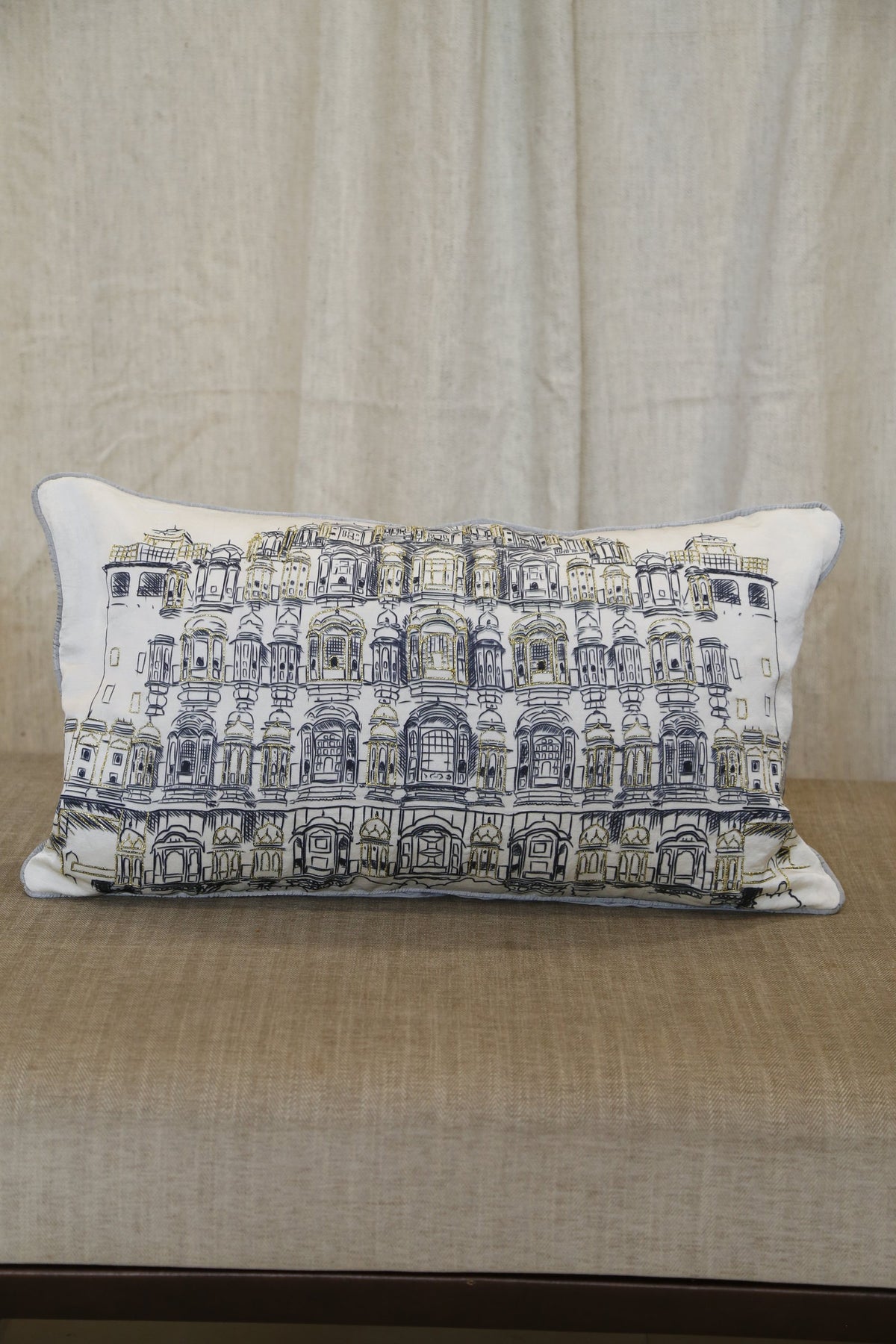 Ivory haveli zari silk lumbar cushion cover, angled view showing the architectural print