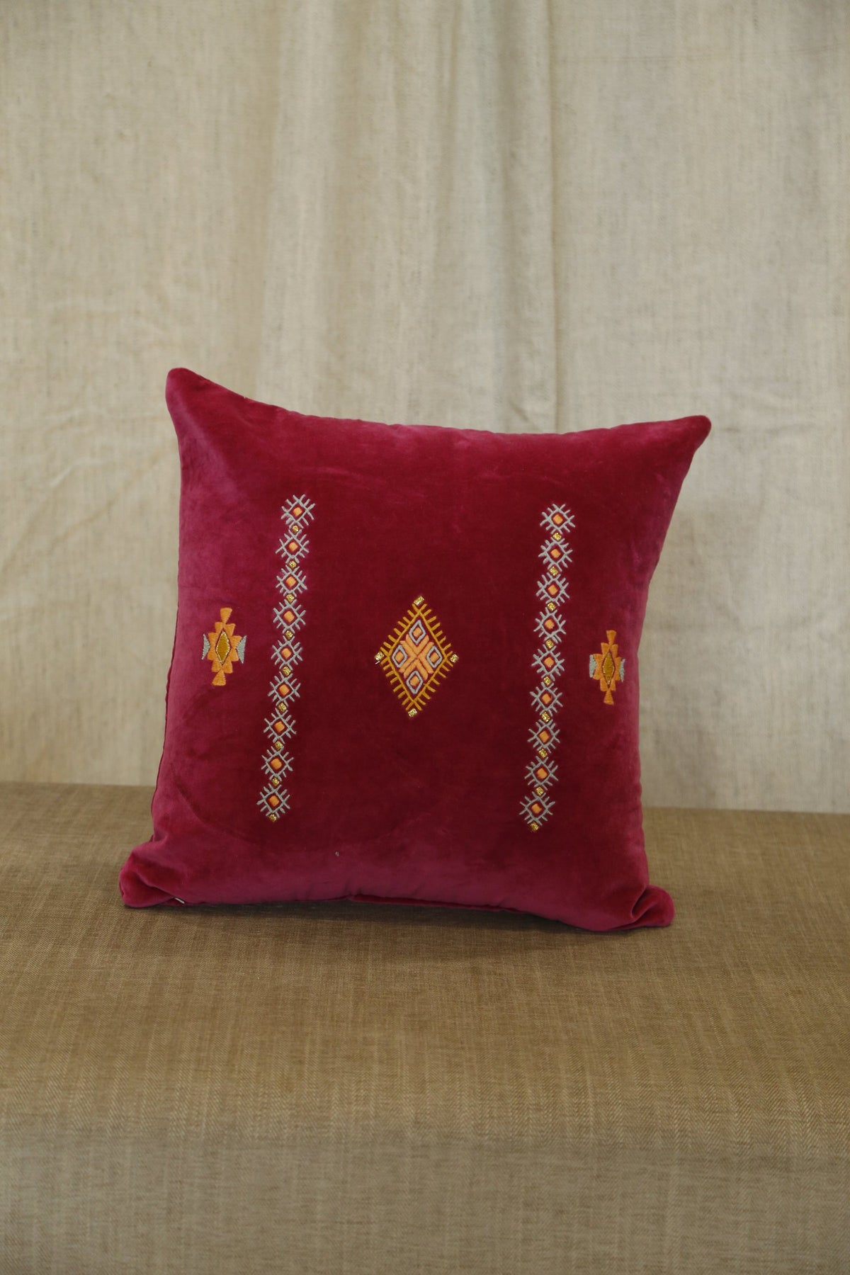 Ruby hand-embroidered velvet cushion cover, angled view