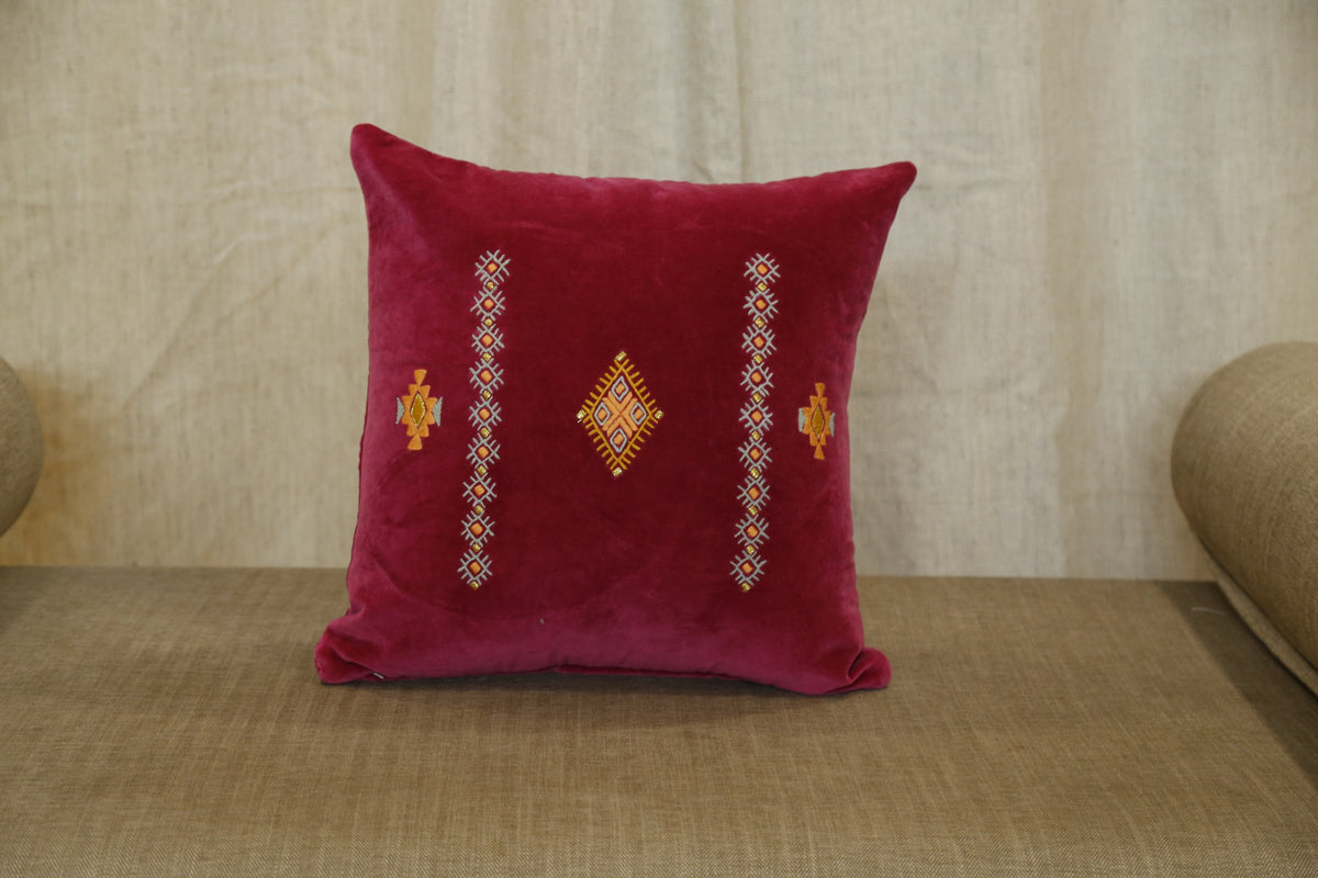Ruby velvet cushion cover showing the gold diamond motif detail