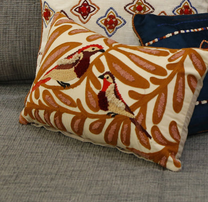 Cotton slub cushion cover embroidered with birds among rust and ochre vines, 18x18 inches