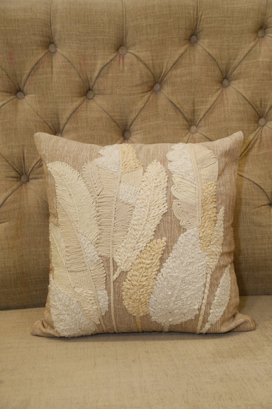 Natural cotton slub cushion cover with raised tonal cream leaf embroidery, front view